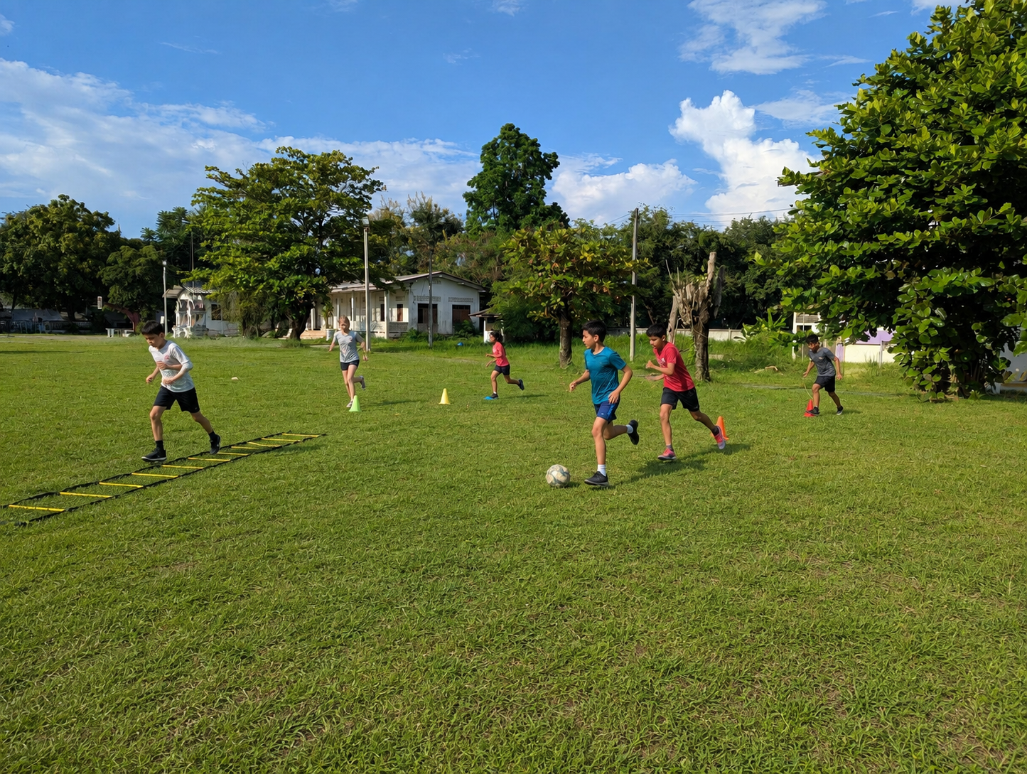 Learners completing an agility and movement circuit on the neighboring grass field